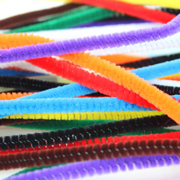 Photo showing some rainbow coloured pipe cleaners that are being used for crafting purposes - arts and crafts / handicrafts.